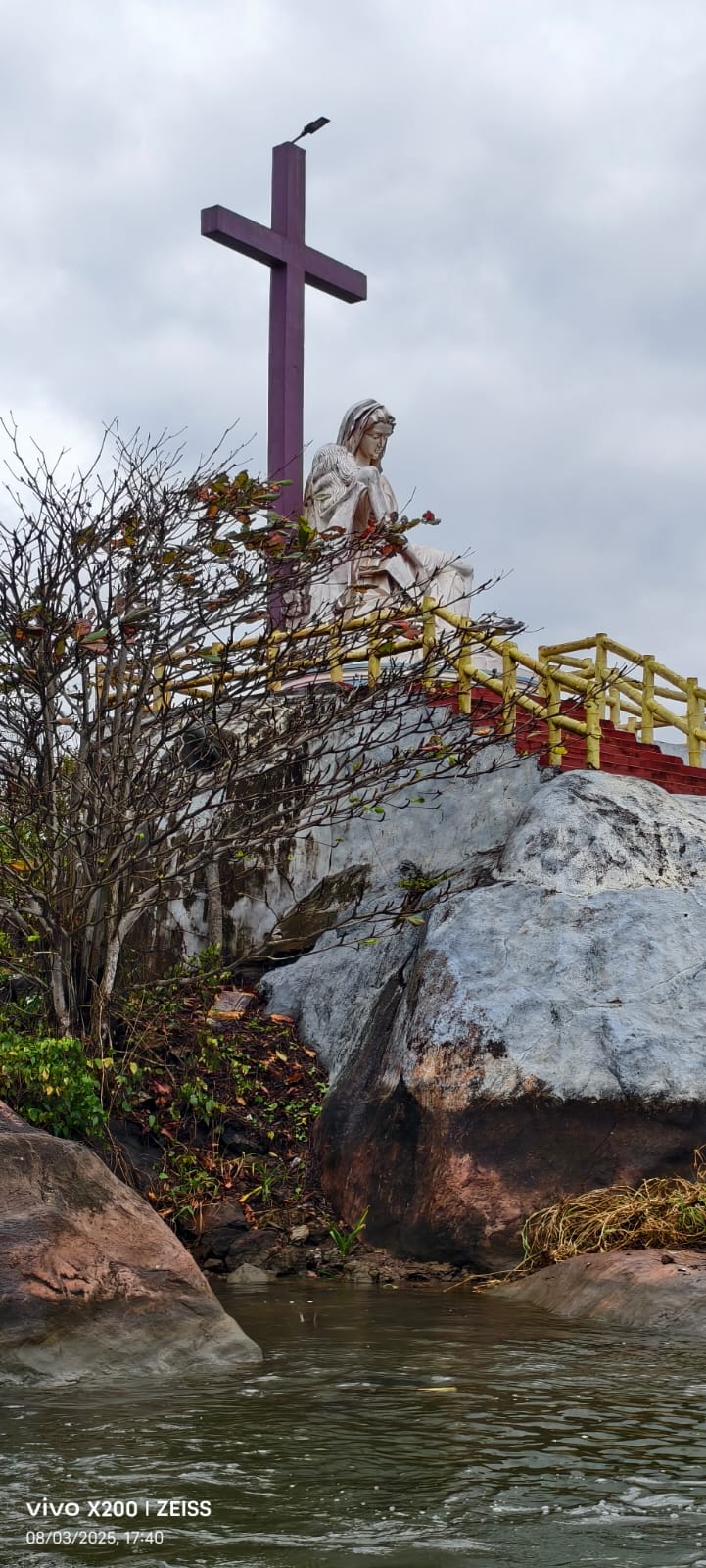 Backwater rock shrine near Poovar